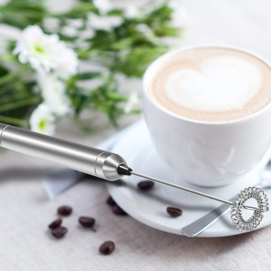 Frother Next To Coffee Cup