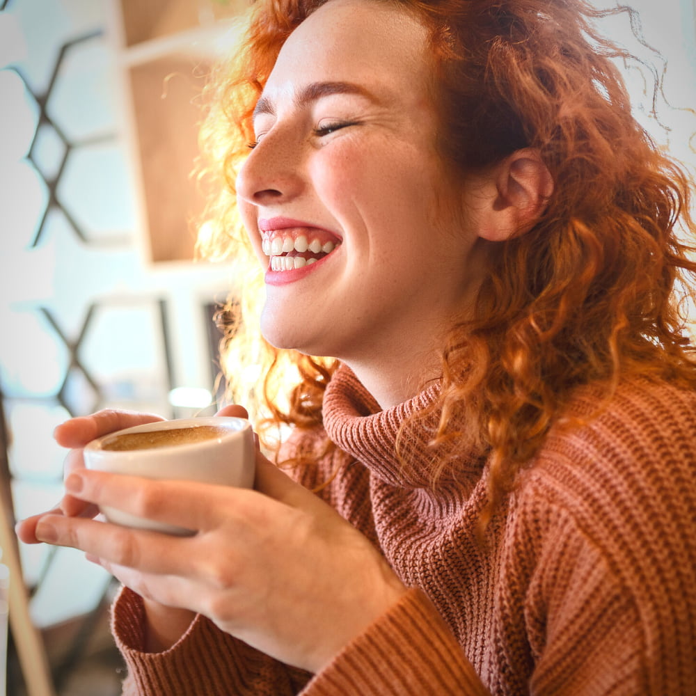 Woman Drinking Coffee in Lake